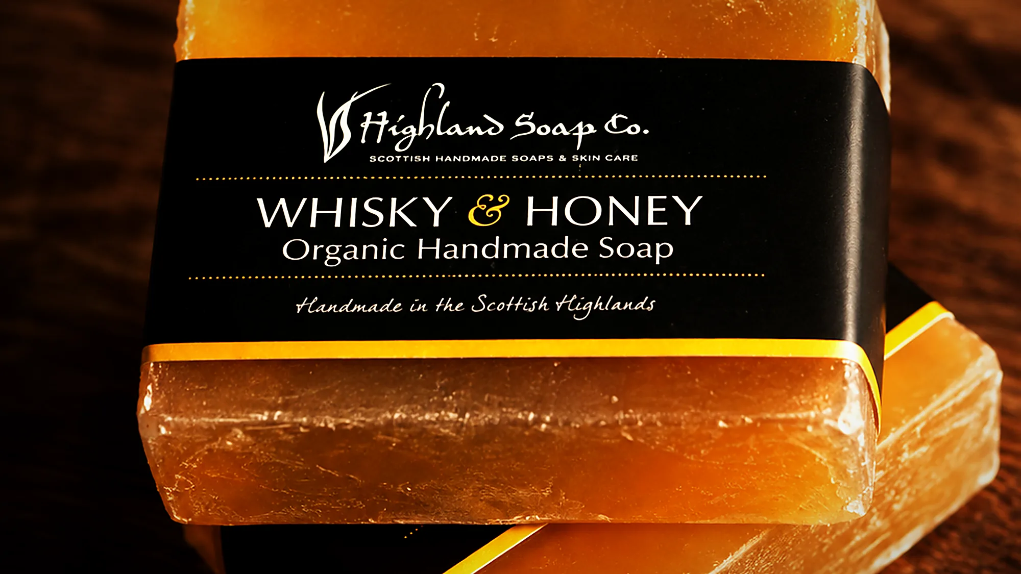 Whisky and honey handmade soap on a timber counter