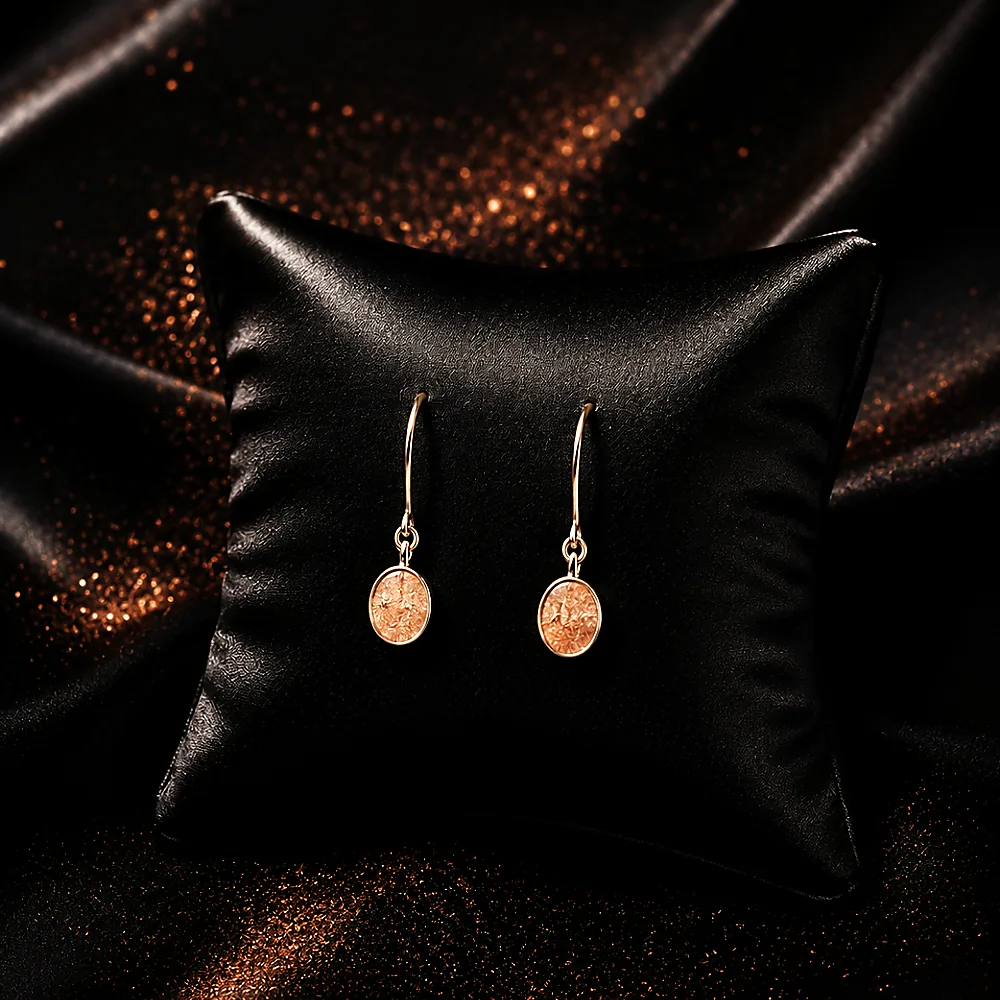 Drop earrings on black silk