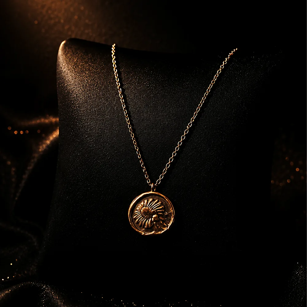A pendant necklace on black silk