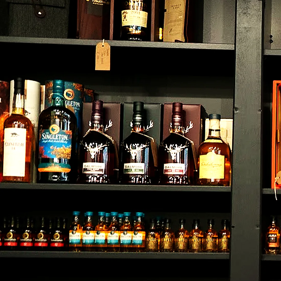Shelves of single malt at the Wild Woven whisky wall
