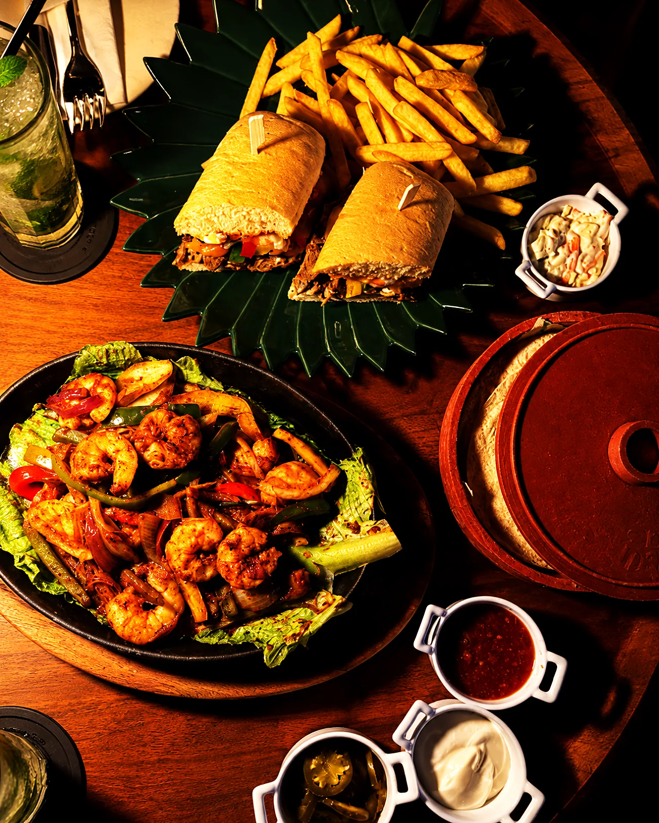 A sharing platter of wraps, fajita chicken and dips