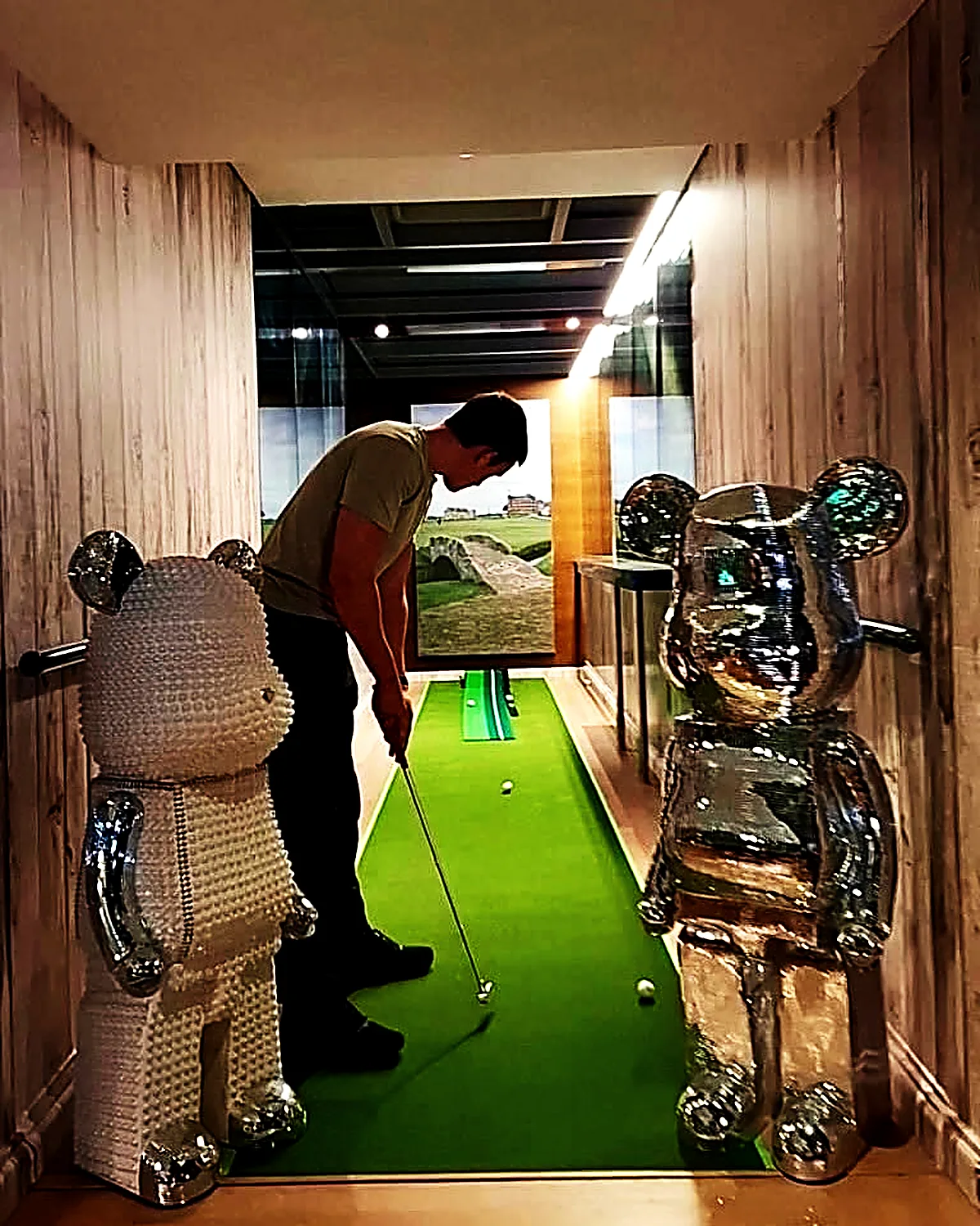 A guest putting on the indoor green at Wild Woven Dubai